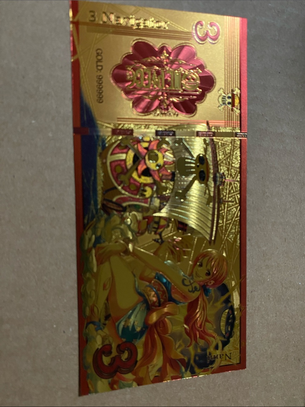 Gold Foil One Piece Anime ft Navigator Collectible Card with Pink Accents